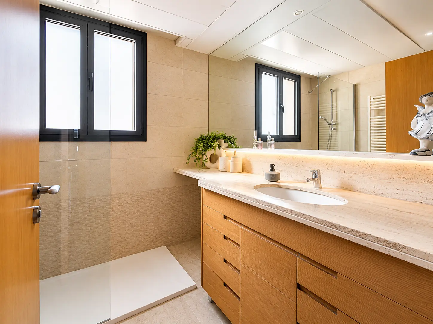 Bathroom with walk-in shower and stone vanity
