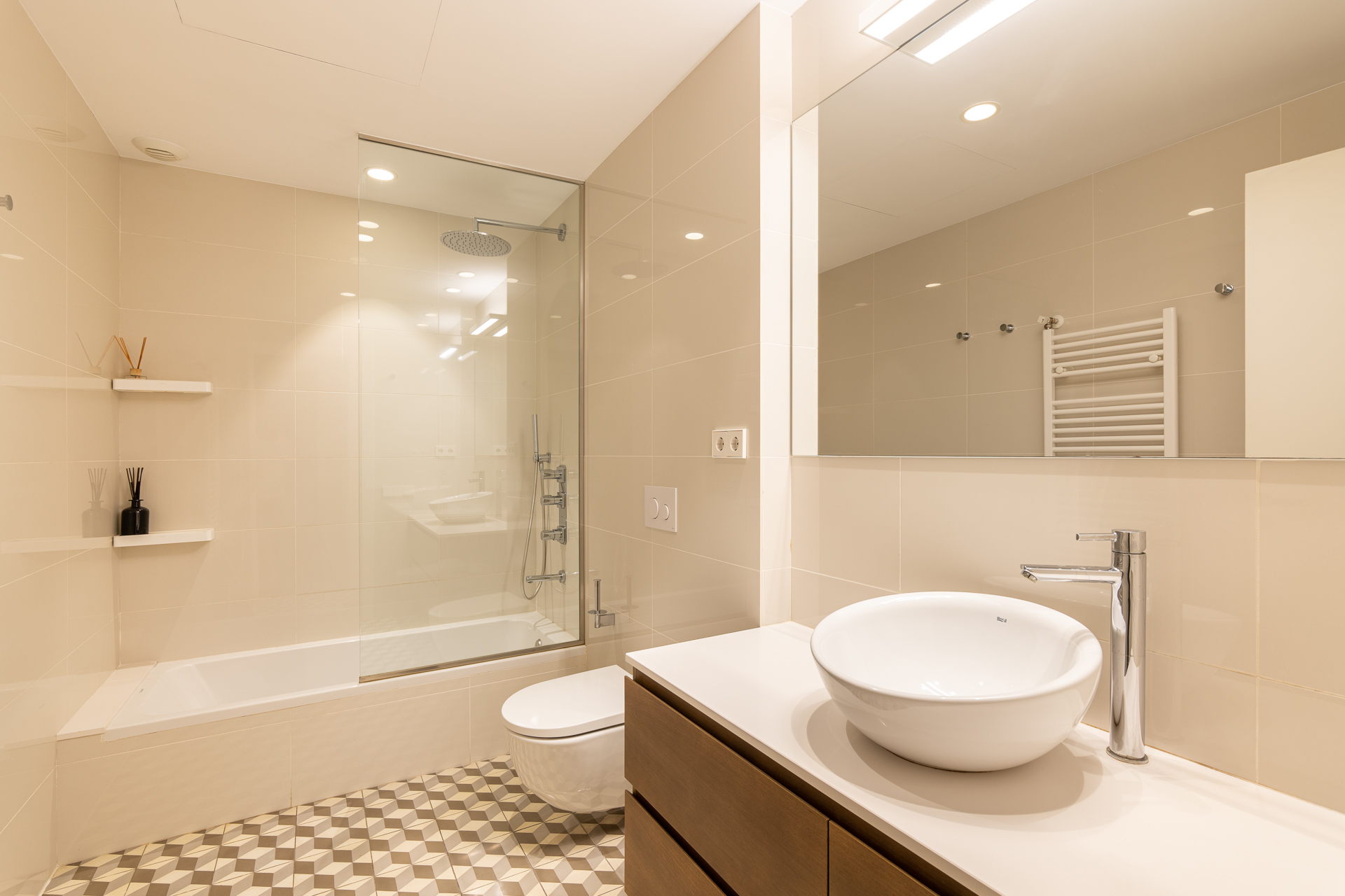 Bathroom with bath and mosaic floor