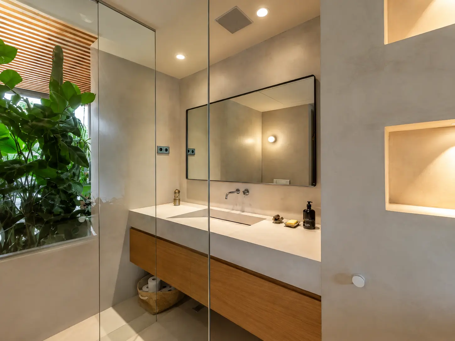 Minimalist bathroom with microcement walls and double vanity