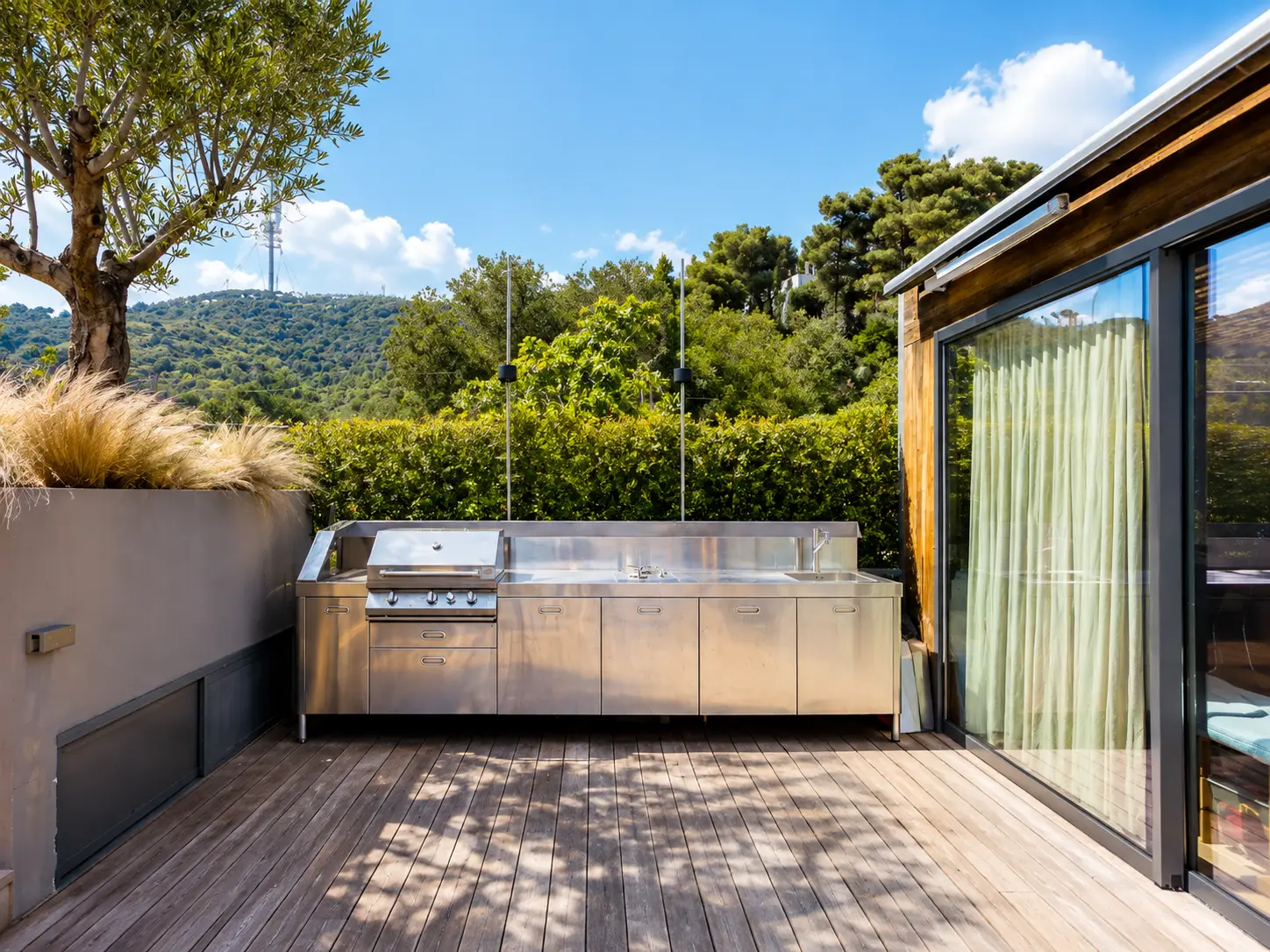 Professional stainless steel outdoor kitchen on the terrace
