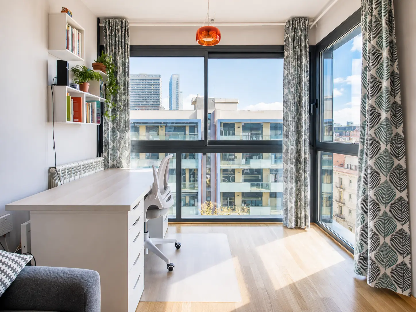 Bedroom used as a study with floor-to-ceiling windows